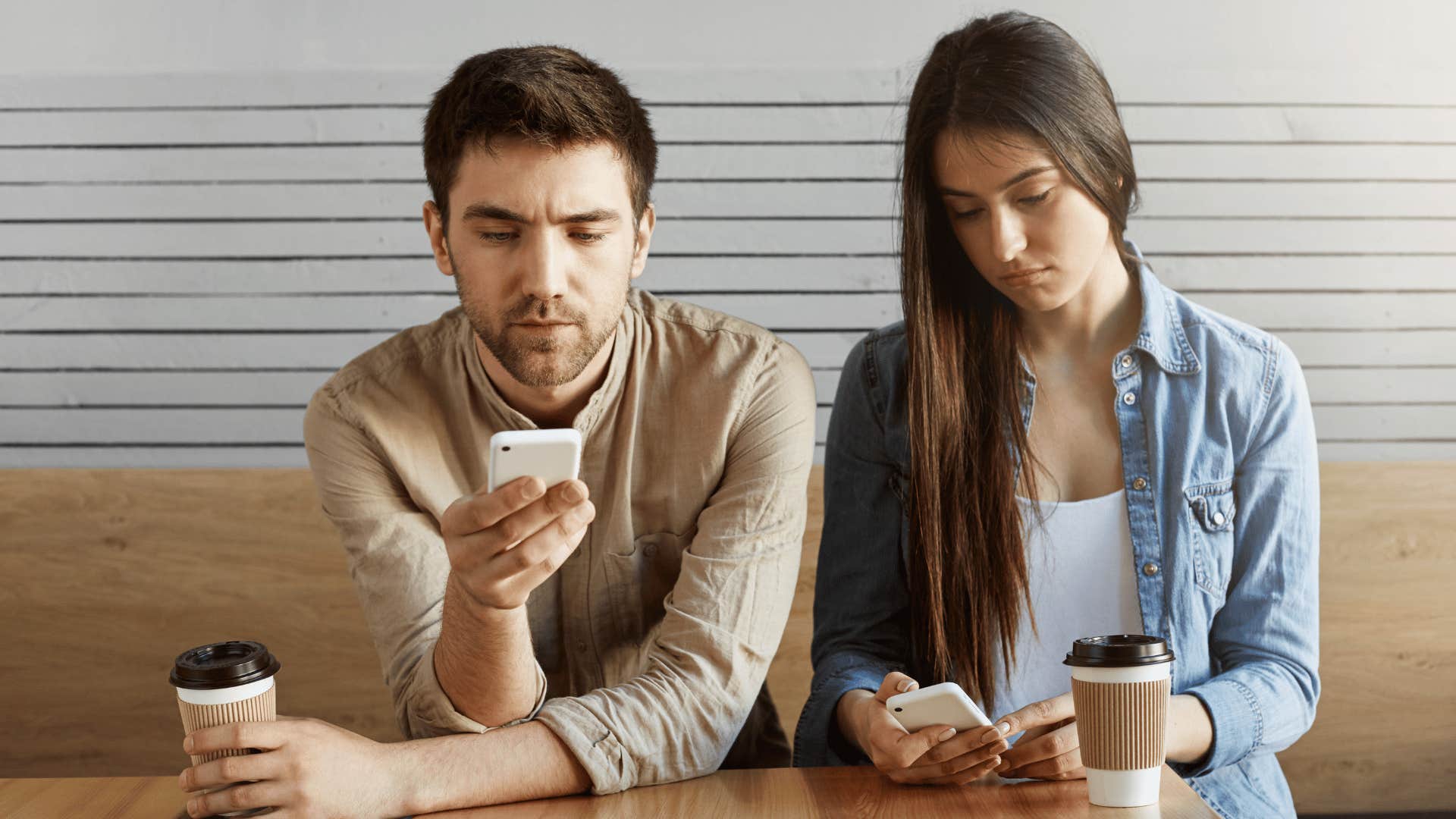 couple scrolling on phones