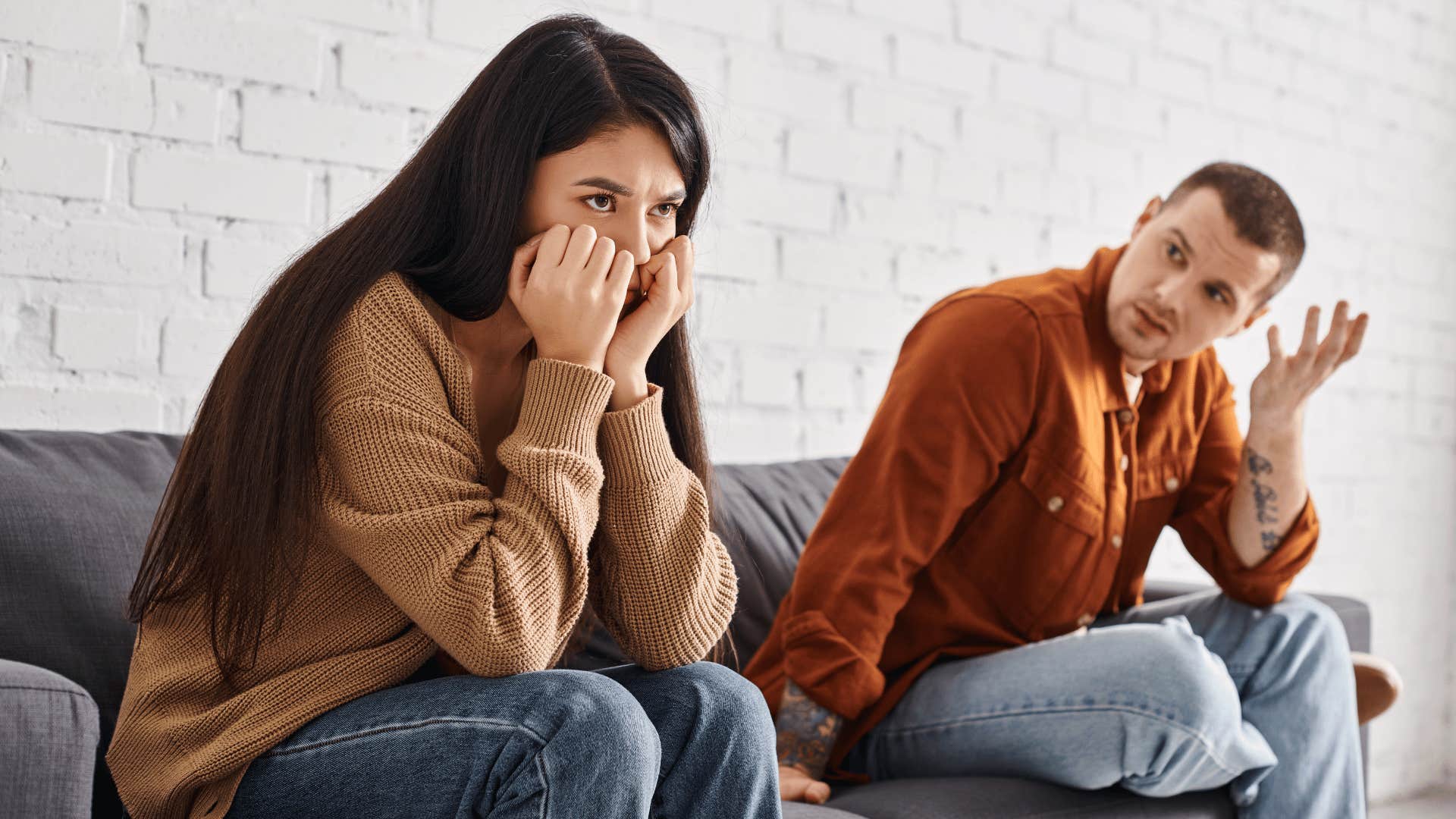 upset couple on couch