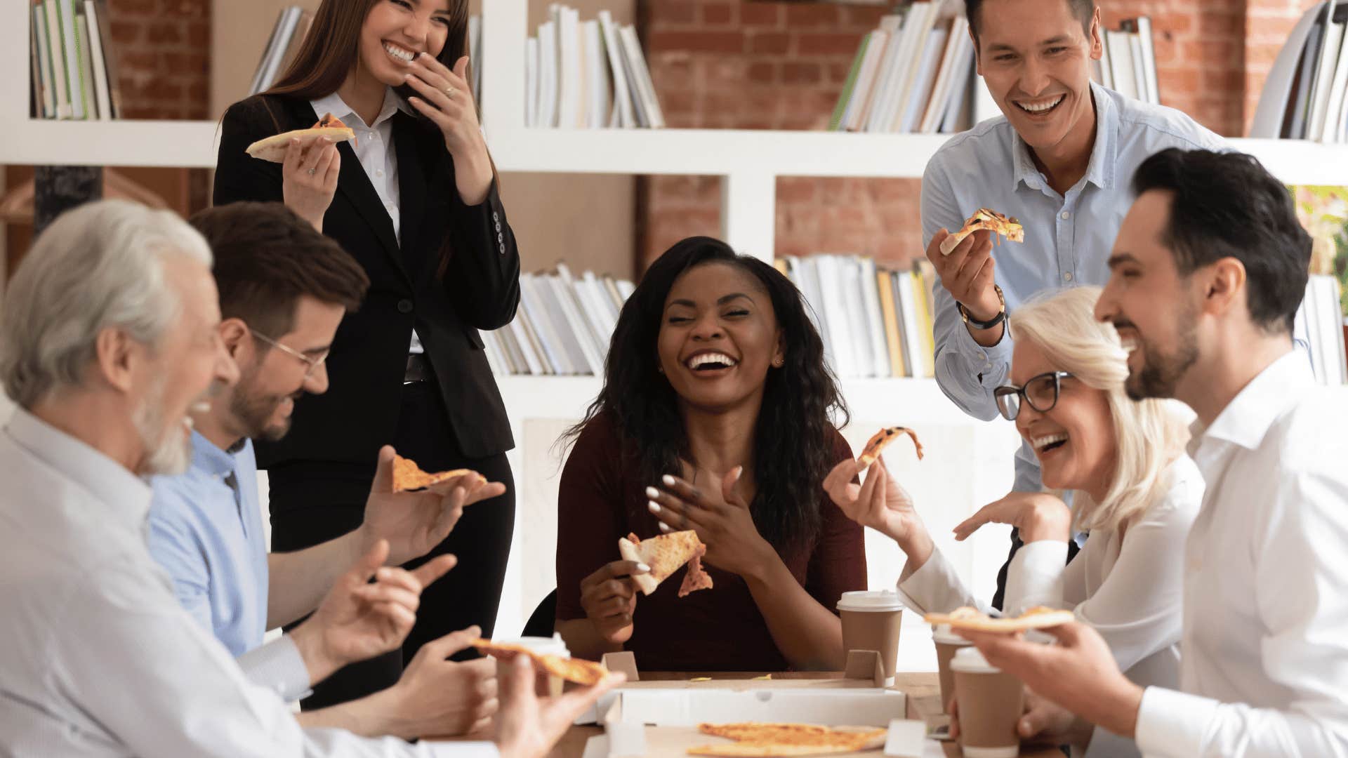 work team socializing during pizza party