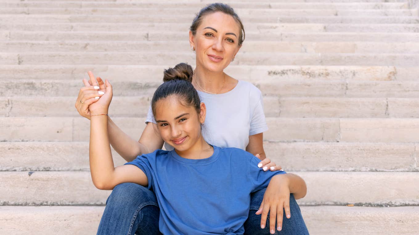 Mom sitting with daughter growing their goal of attachment