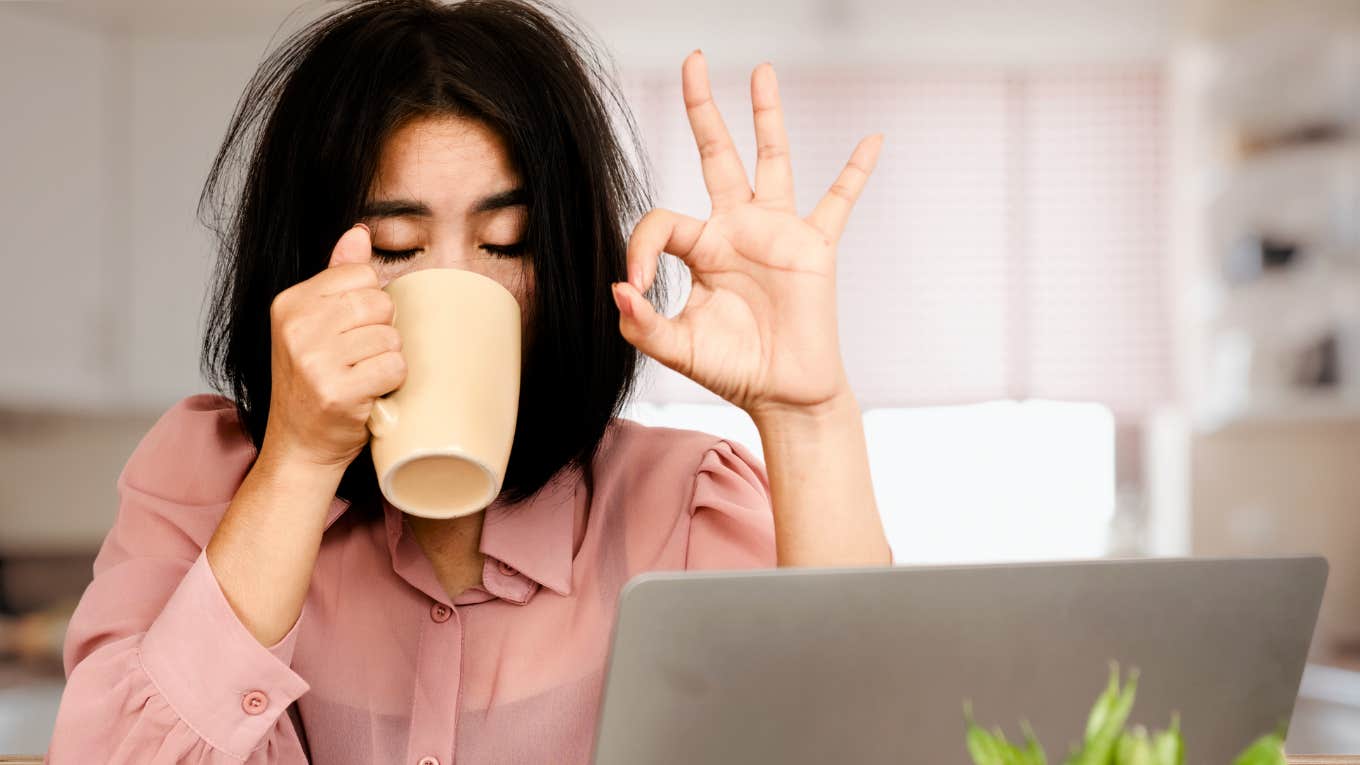 Woman telling herself she's okay, workaholic