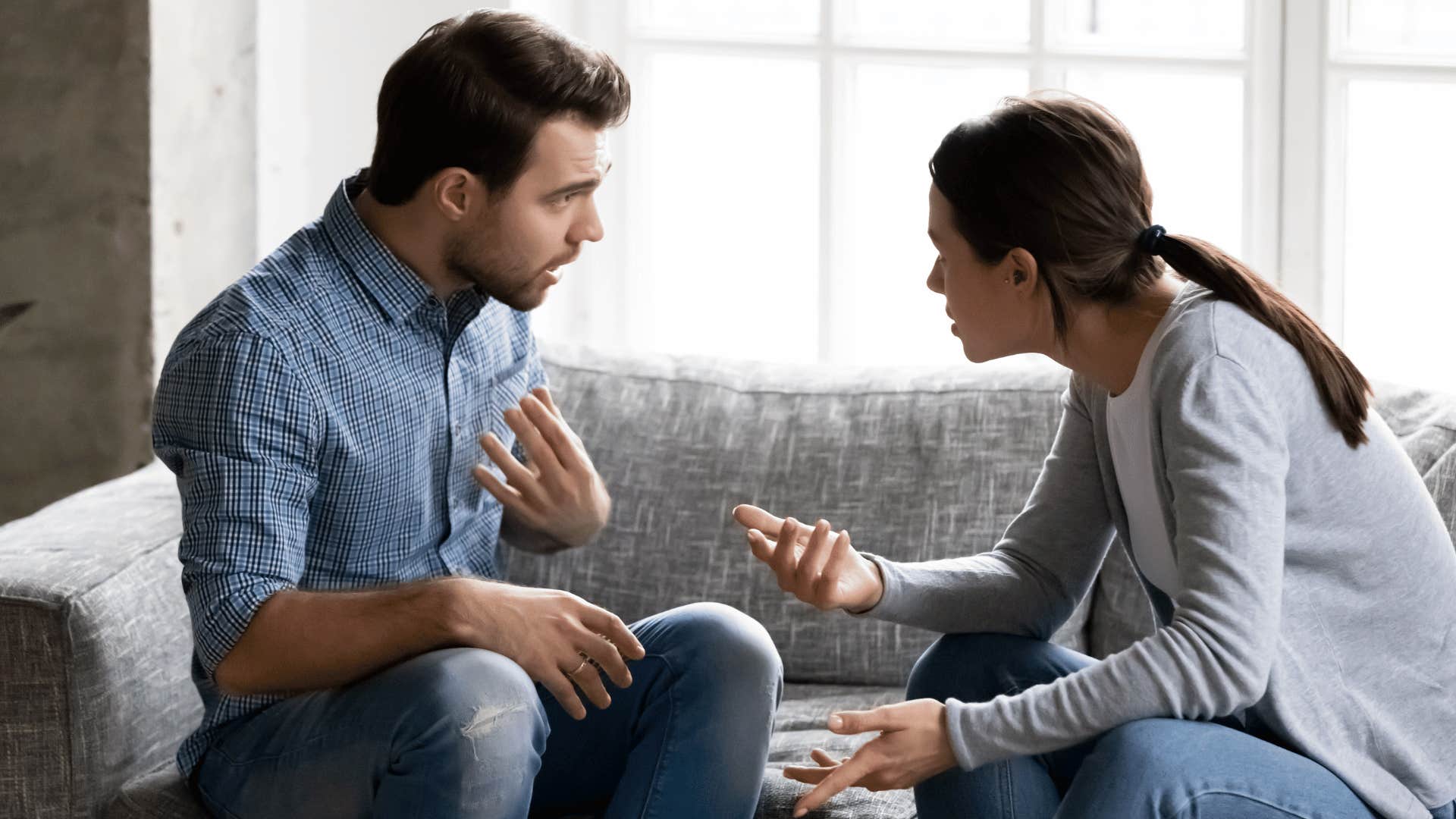 couple arguing on couch