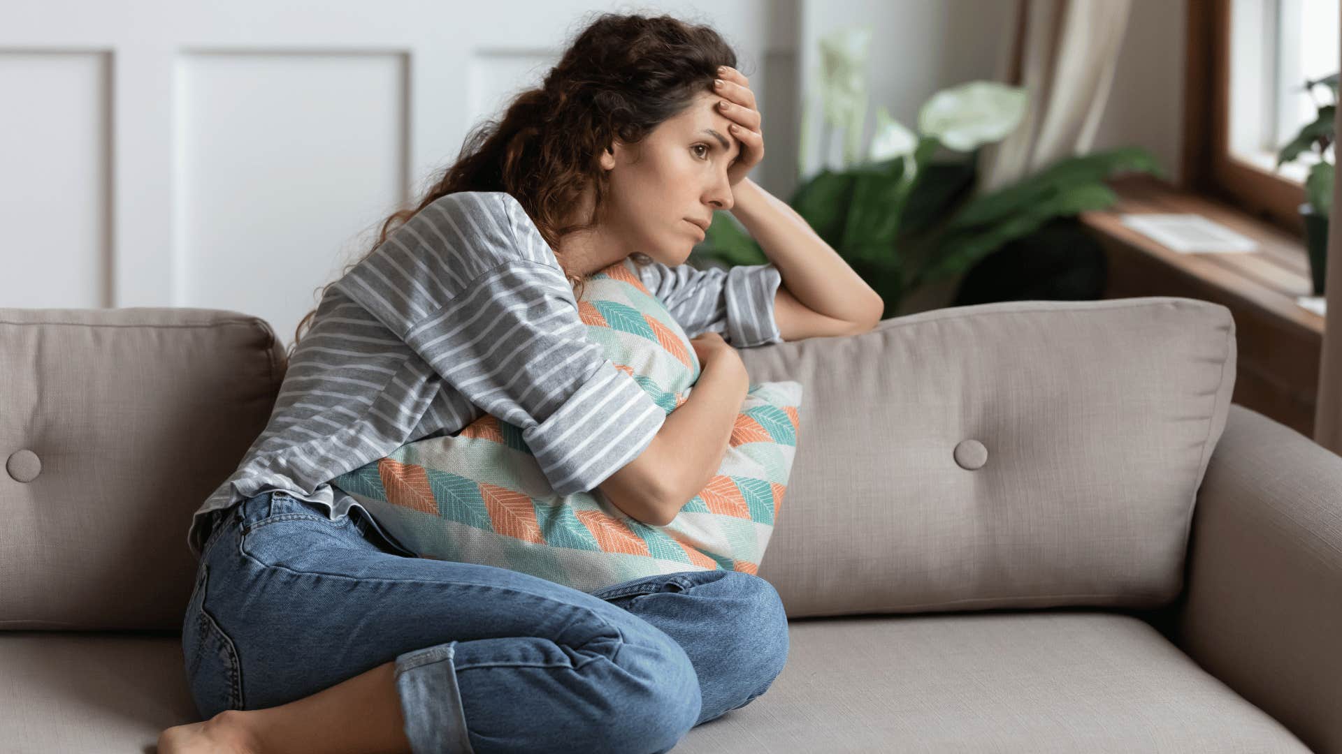 anxious woman on couch