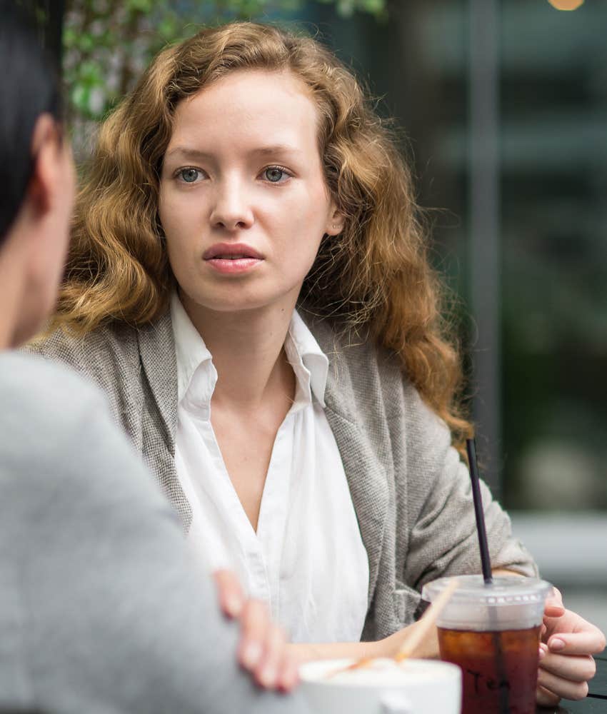 Woman in a bad mood at a cafe causing heartache in her marriage