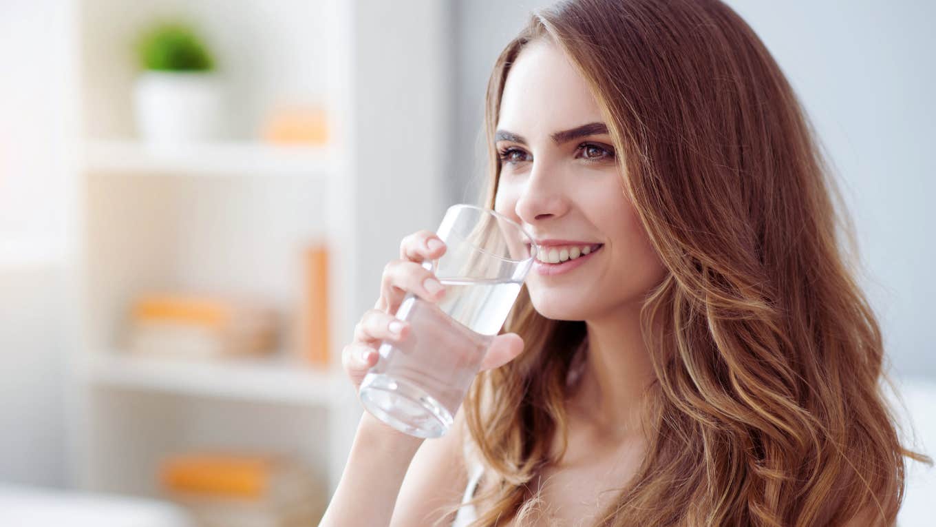 woman drinking glass of water