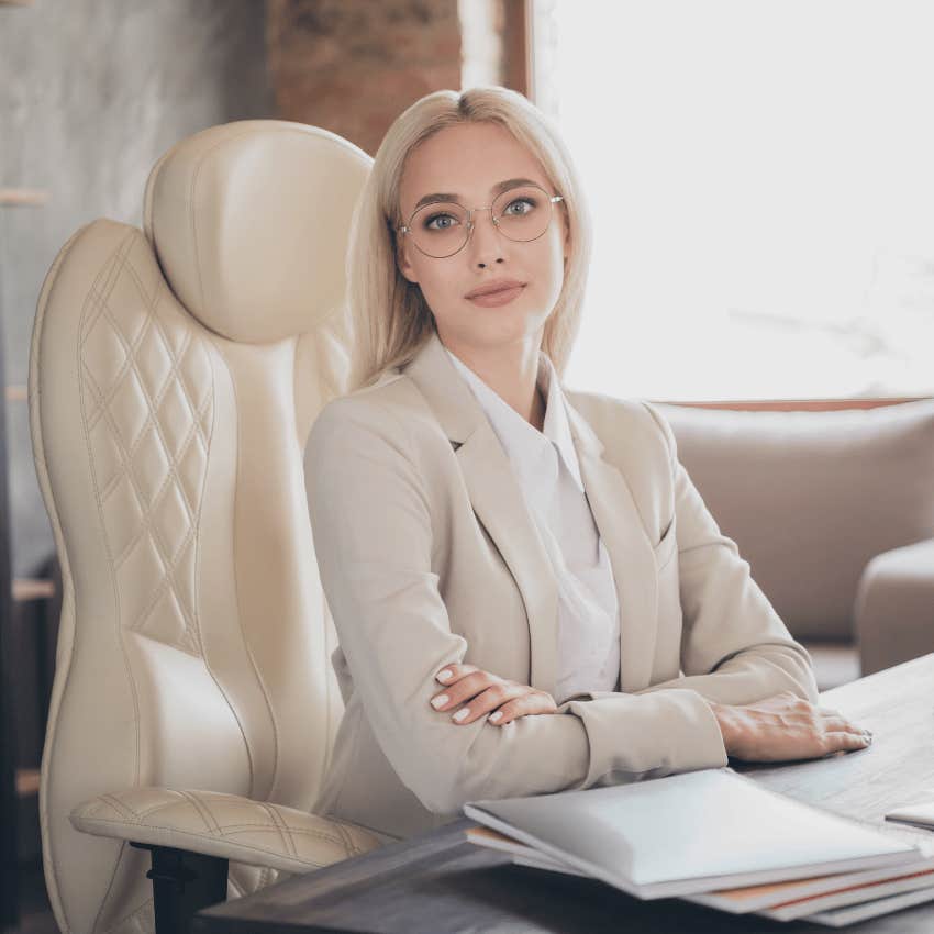 blonde business woman sitting at desk