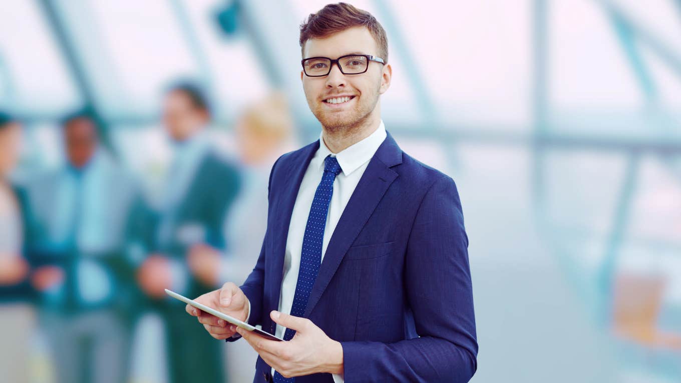 Boss smiling at employees who don't work from home. 