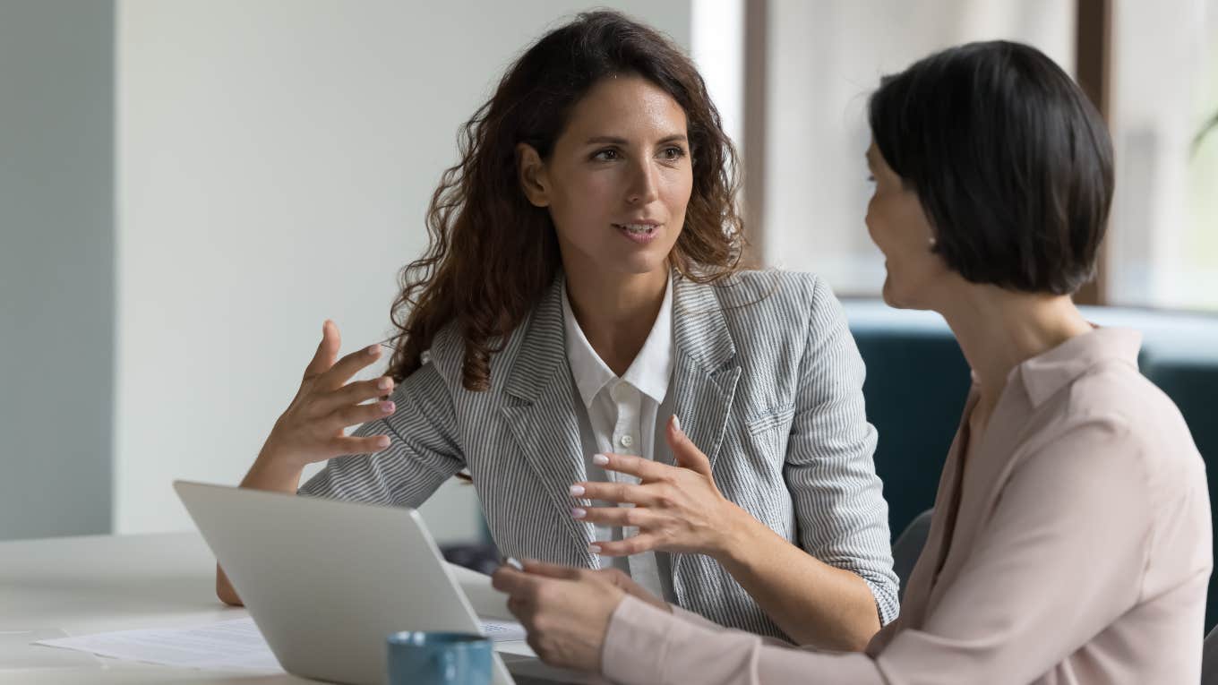 Low-paid worker talking to boss about constant comments