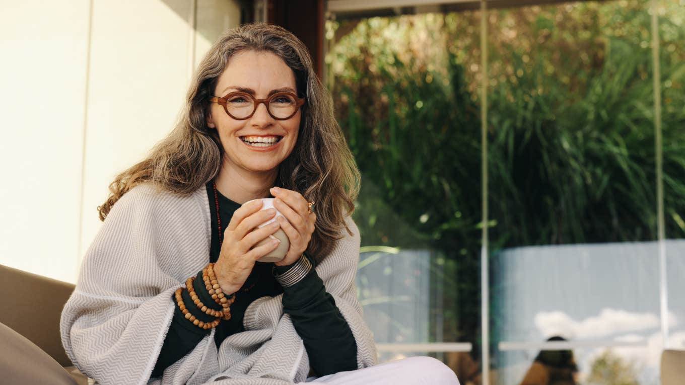 Vibrant and healthy woman drinking a cup of tea