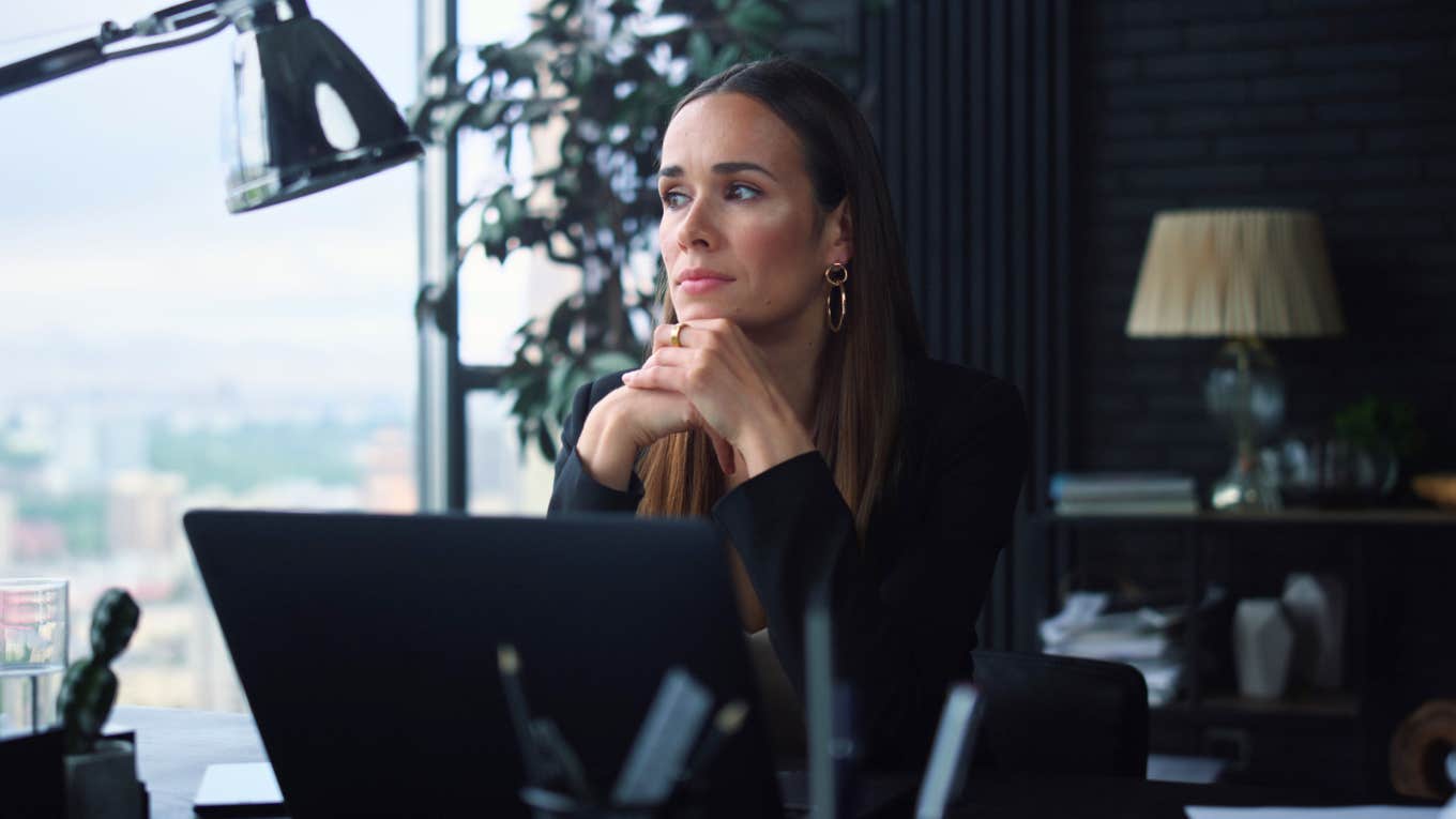 Woman at work feeling burnt out and unmotivated