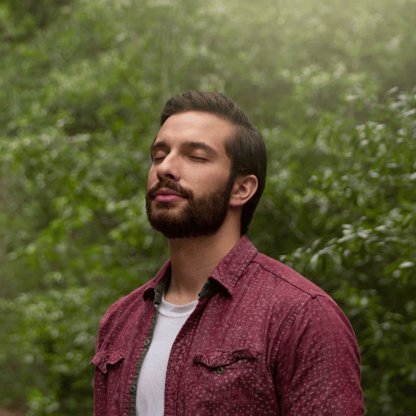 calm man breathing in fresh air