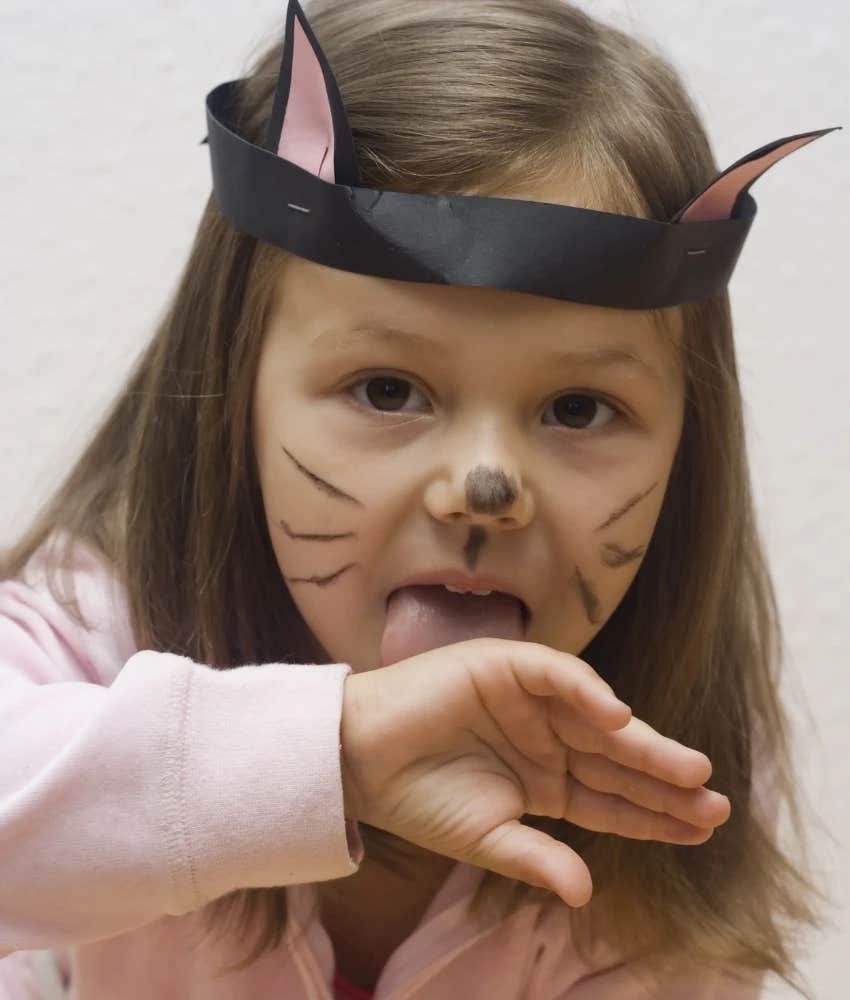 Little girl in cat phase