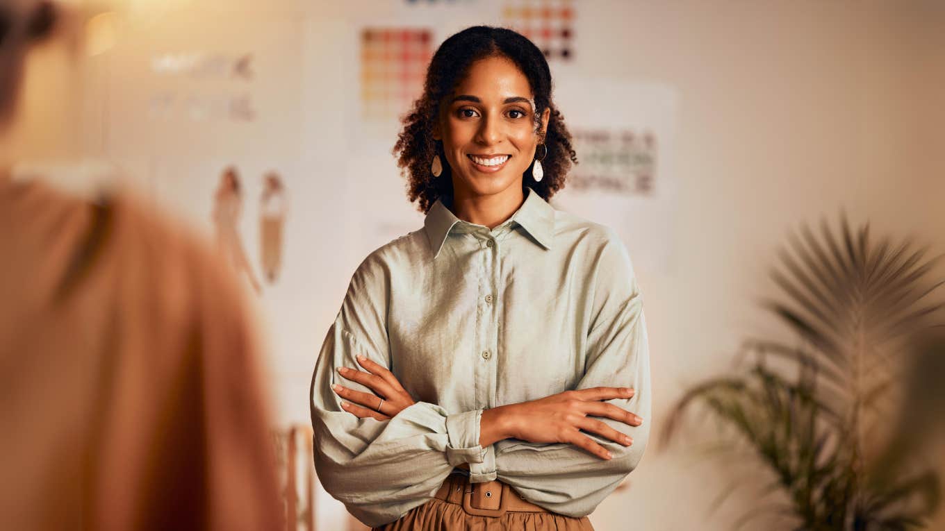 Smiling woman standing out at work