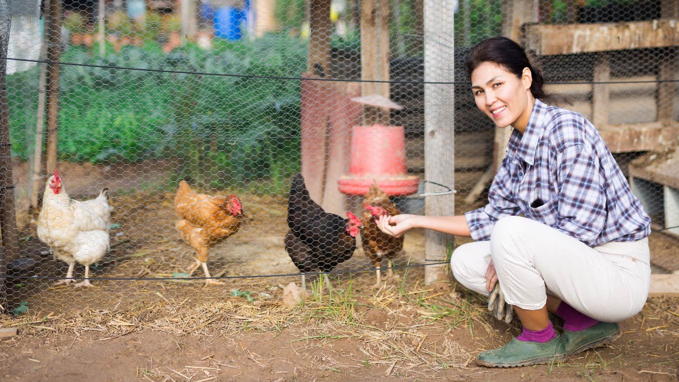 Woman chicken-sizing