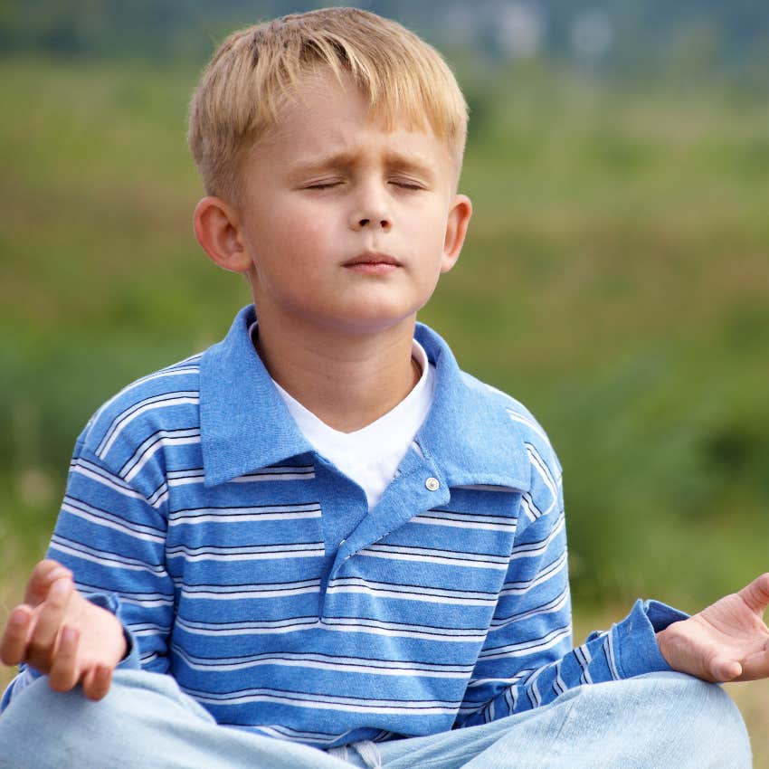 Little boy using breathing exercise to self-regulate