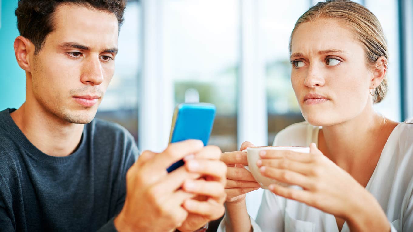 Woman being ignored, man clearly not into her.