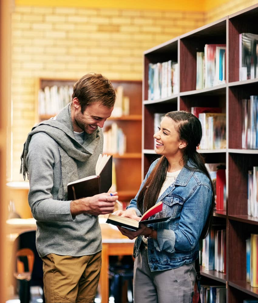 college couple flirting in the library