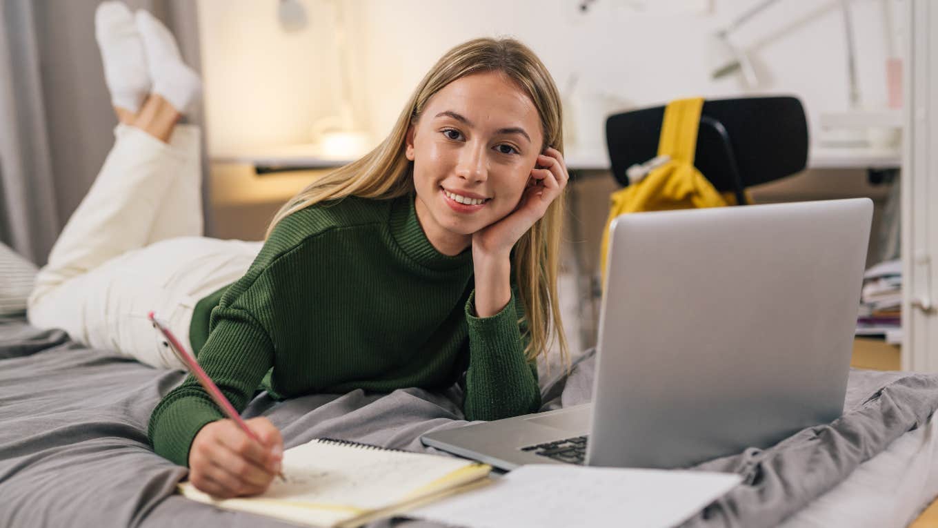 College student on dorm bed