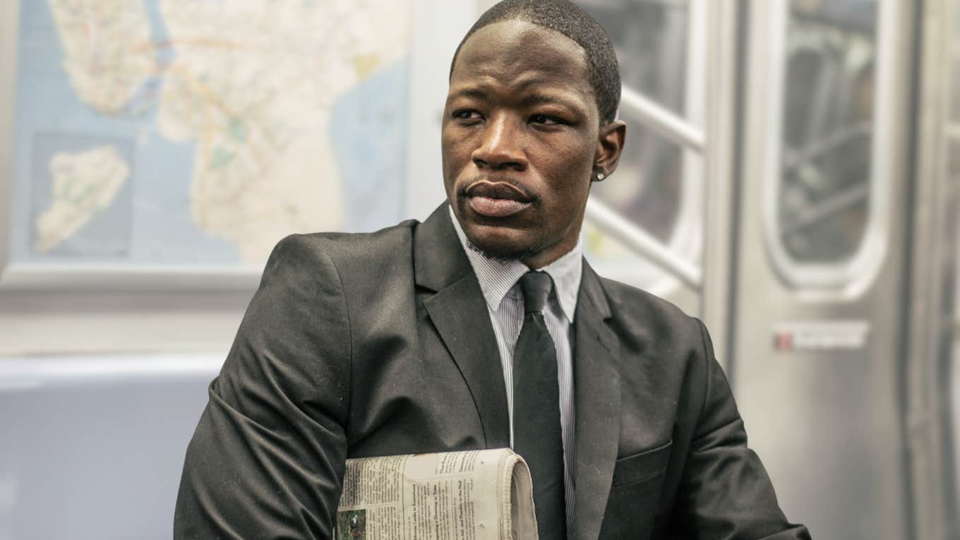 Professional man sitting on public transportation subway. 