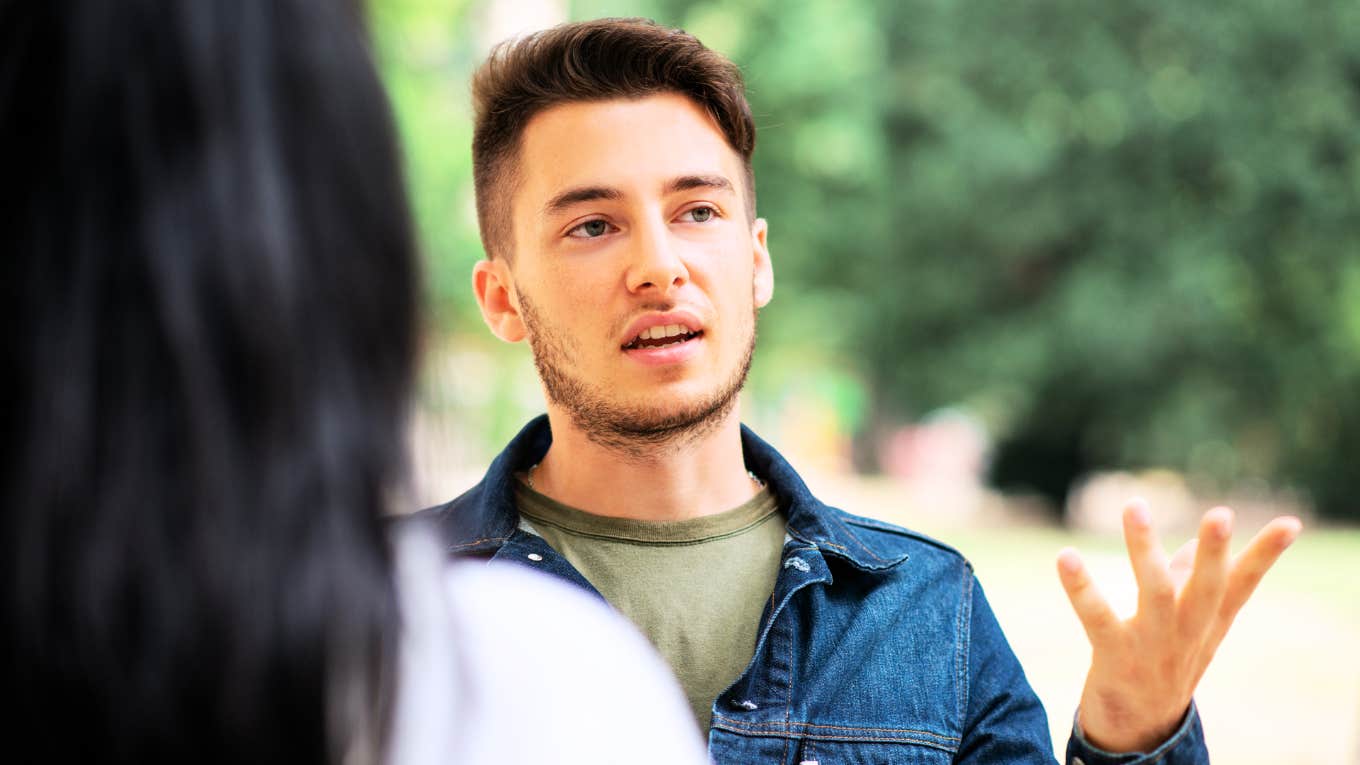 Man talking to intimidating woman