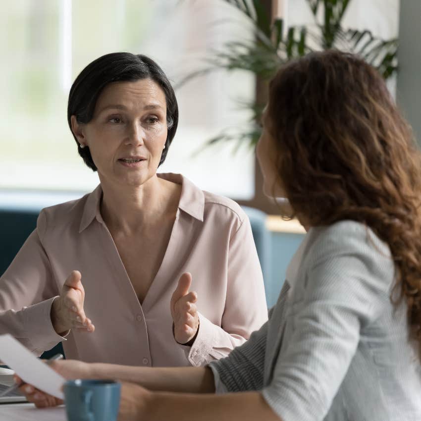 Woman having a conversation to shutdown a mean coworker