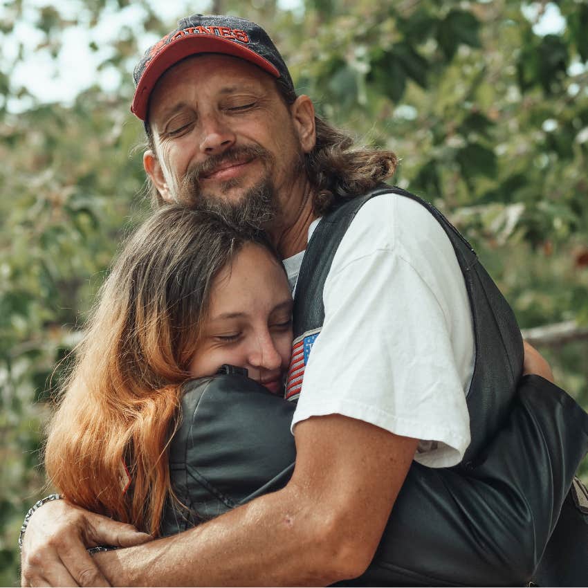 Sad parent hugging their young daughter. 