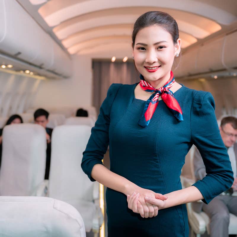 flight attendant smiling on plane