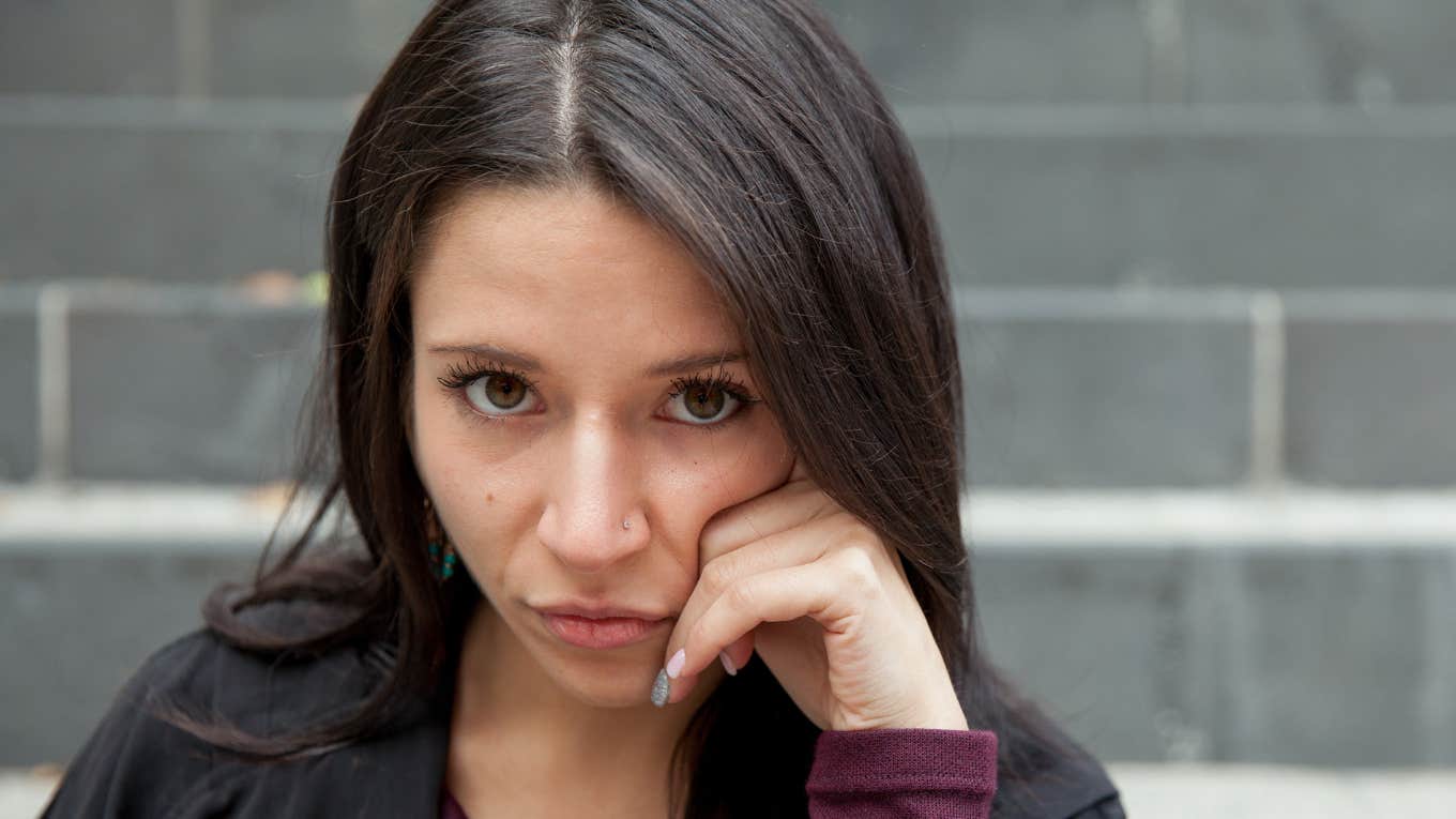 young brunette woman looking serious