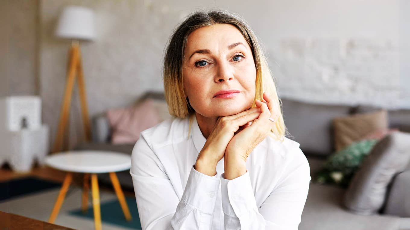 Divorced woman sitting stoically 