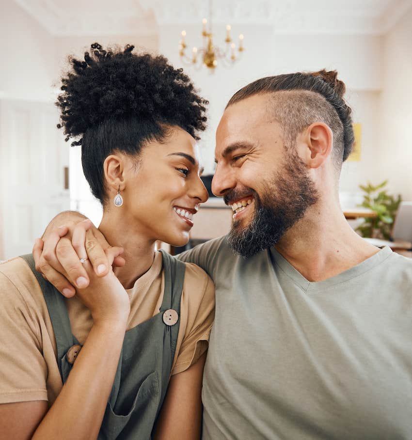 Couple looks into each other's eyes and smiles