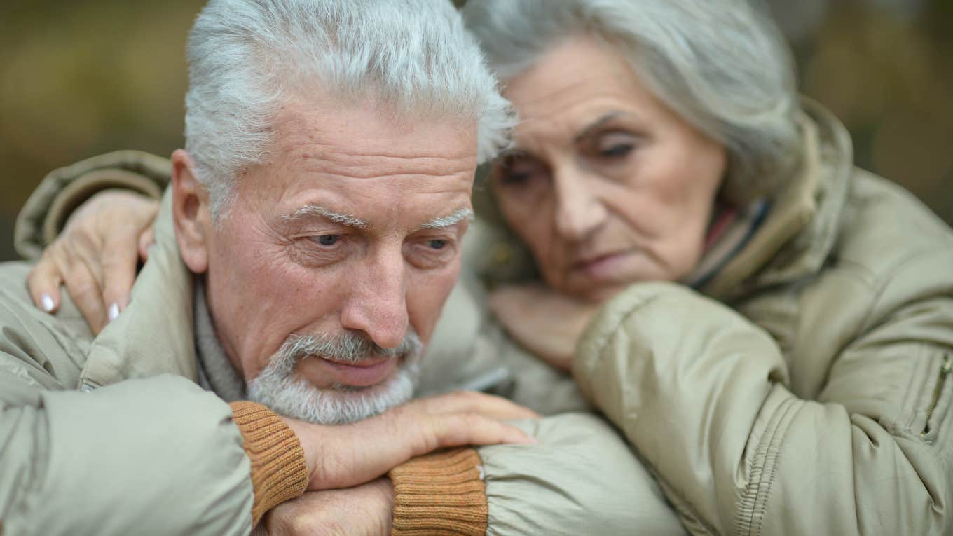 Parents of narcissistic adult children looking sad together.