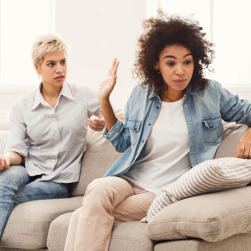 Two parties in a friendship arguing on a couch. 