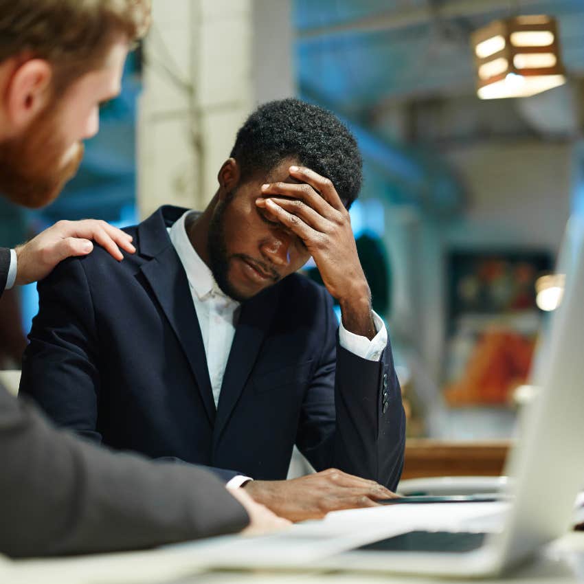 Work from home employee looking upset at his desk. 