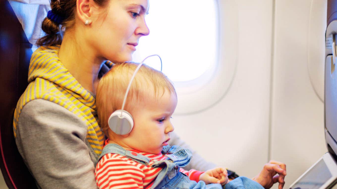 woman on plane with baby 