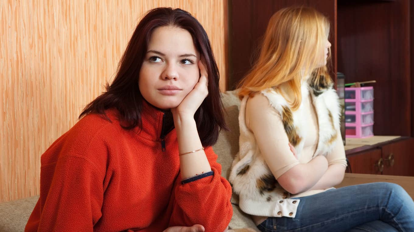 two sisters ignoring each other