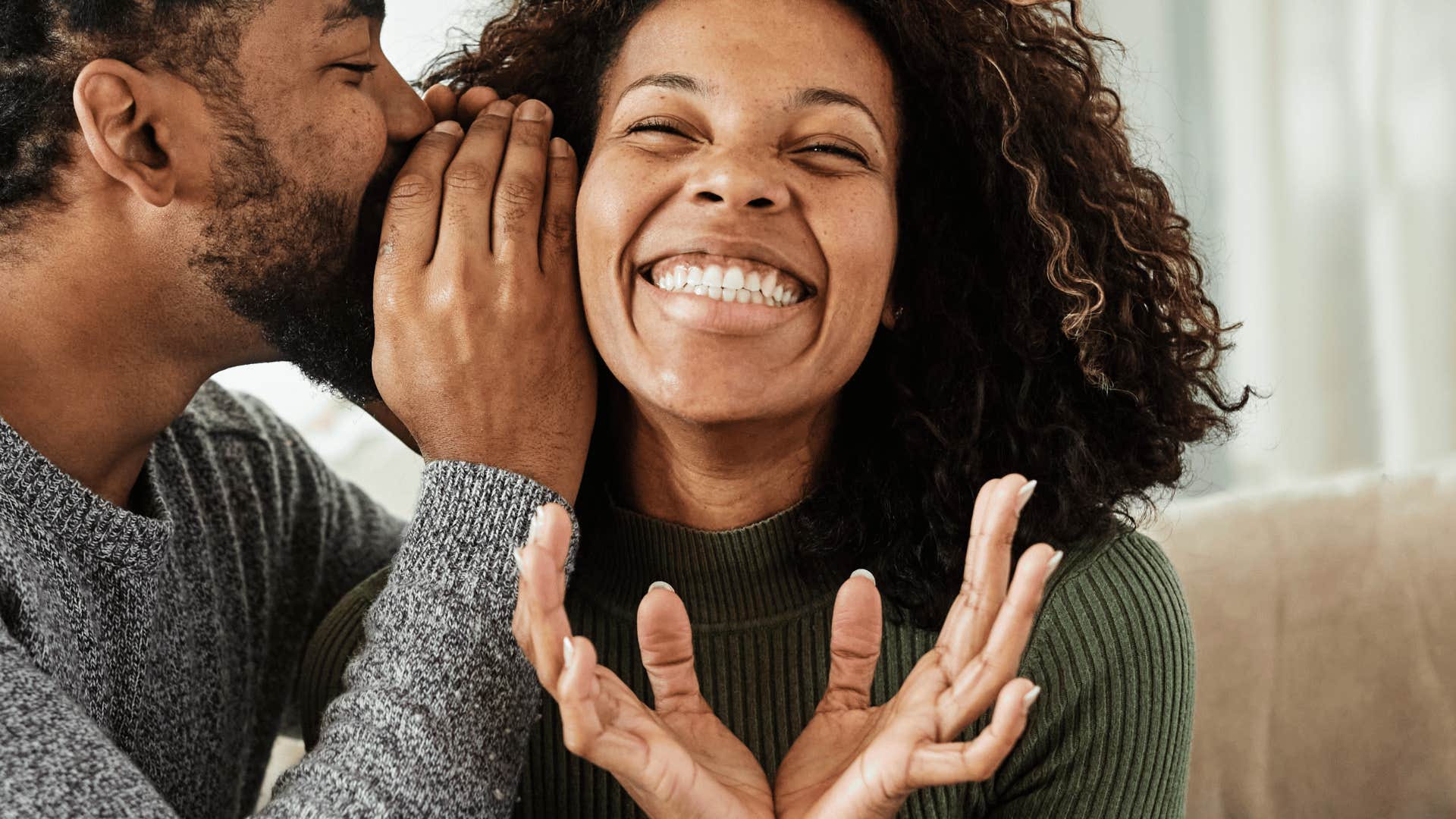 He whispers in her ear and she feels joy