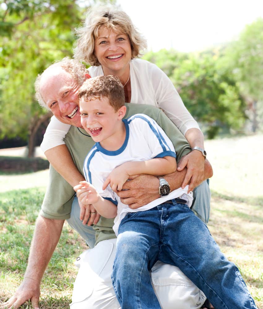 grandparents with grandson they helped raise