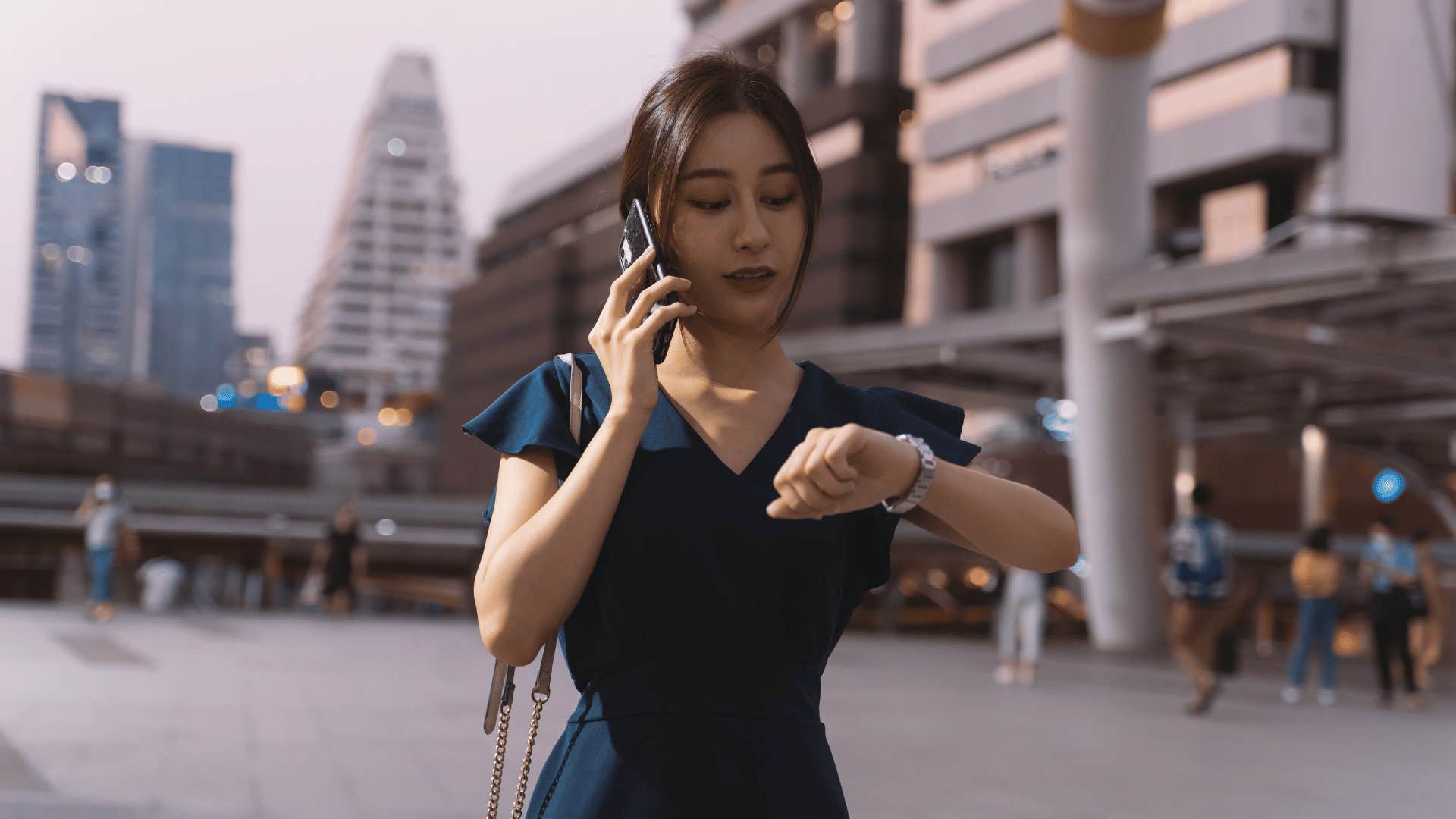 woman looking at her watch