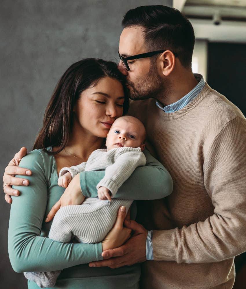 happy couple with newborn