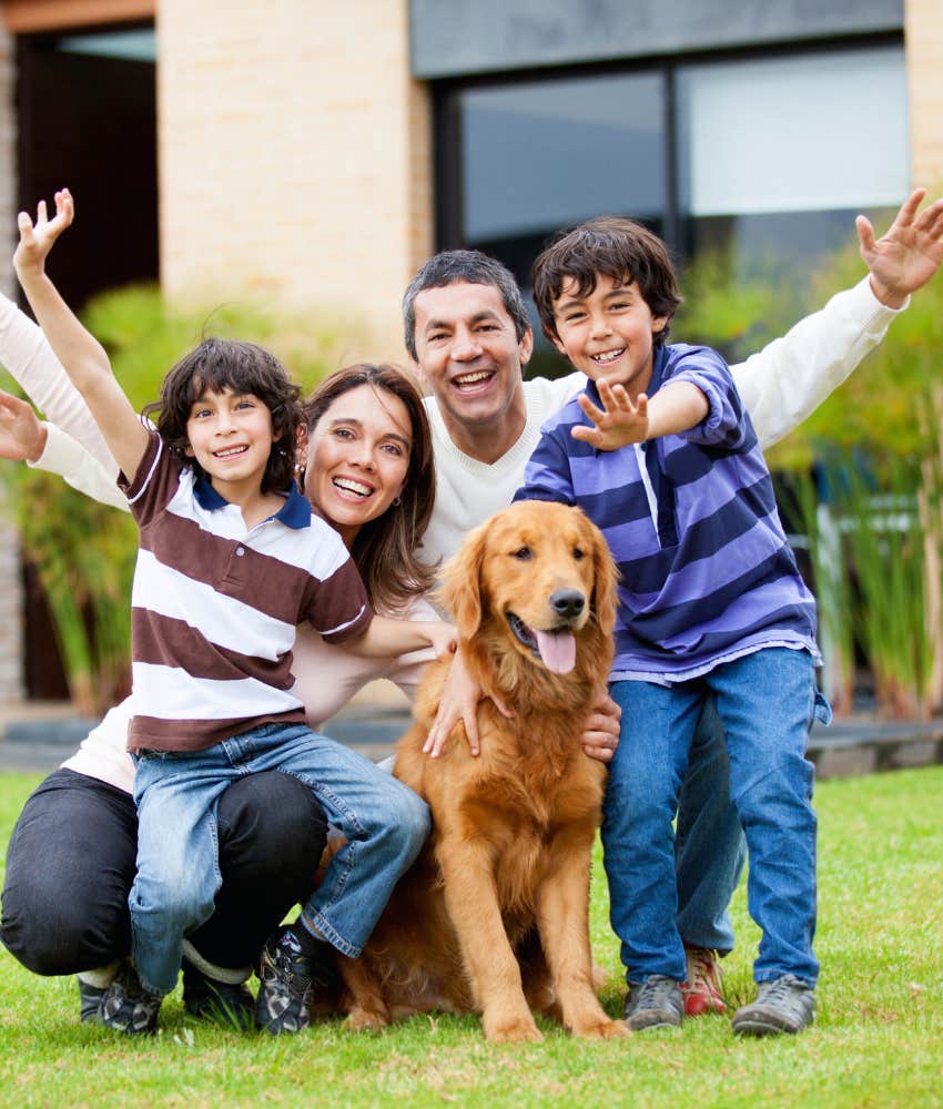 happy family posed with their dog