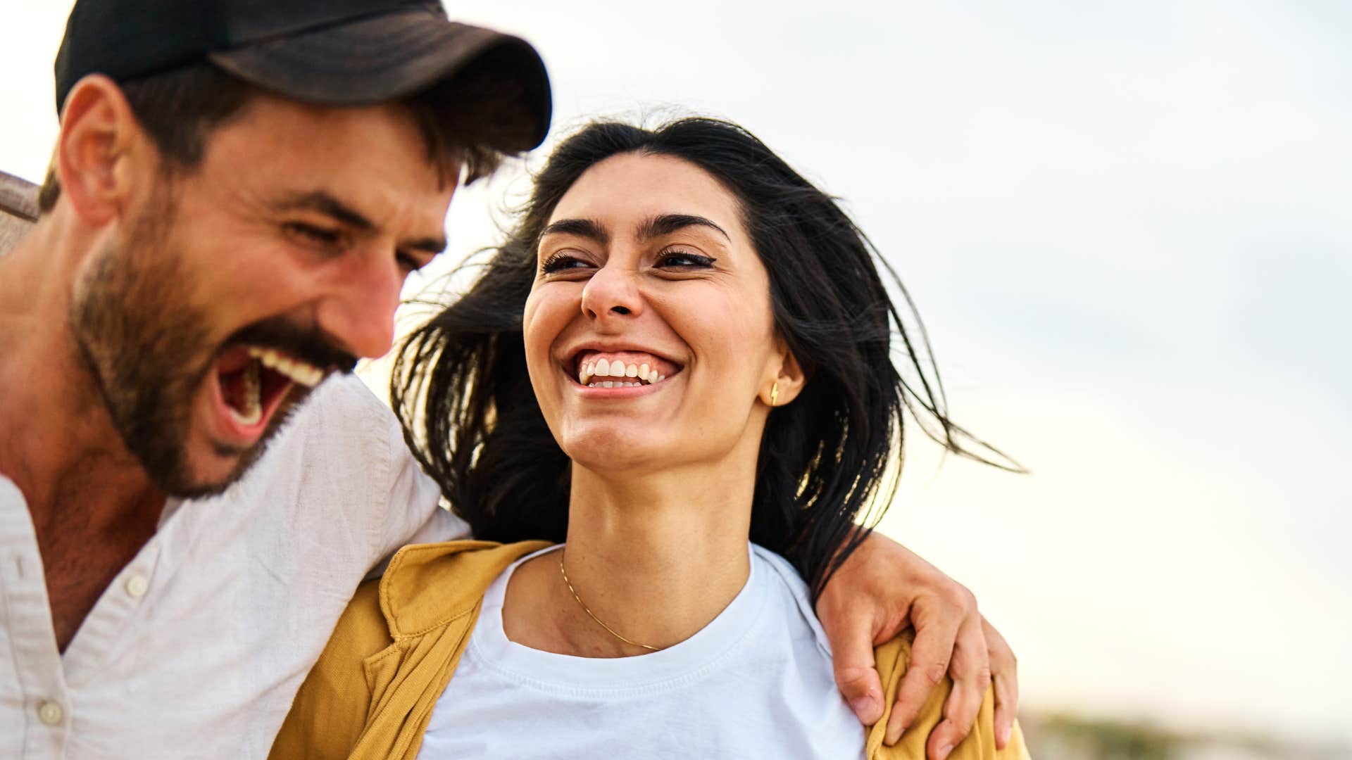 Couple laughing, healthy relationship communication