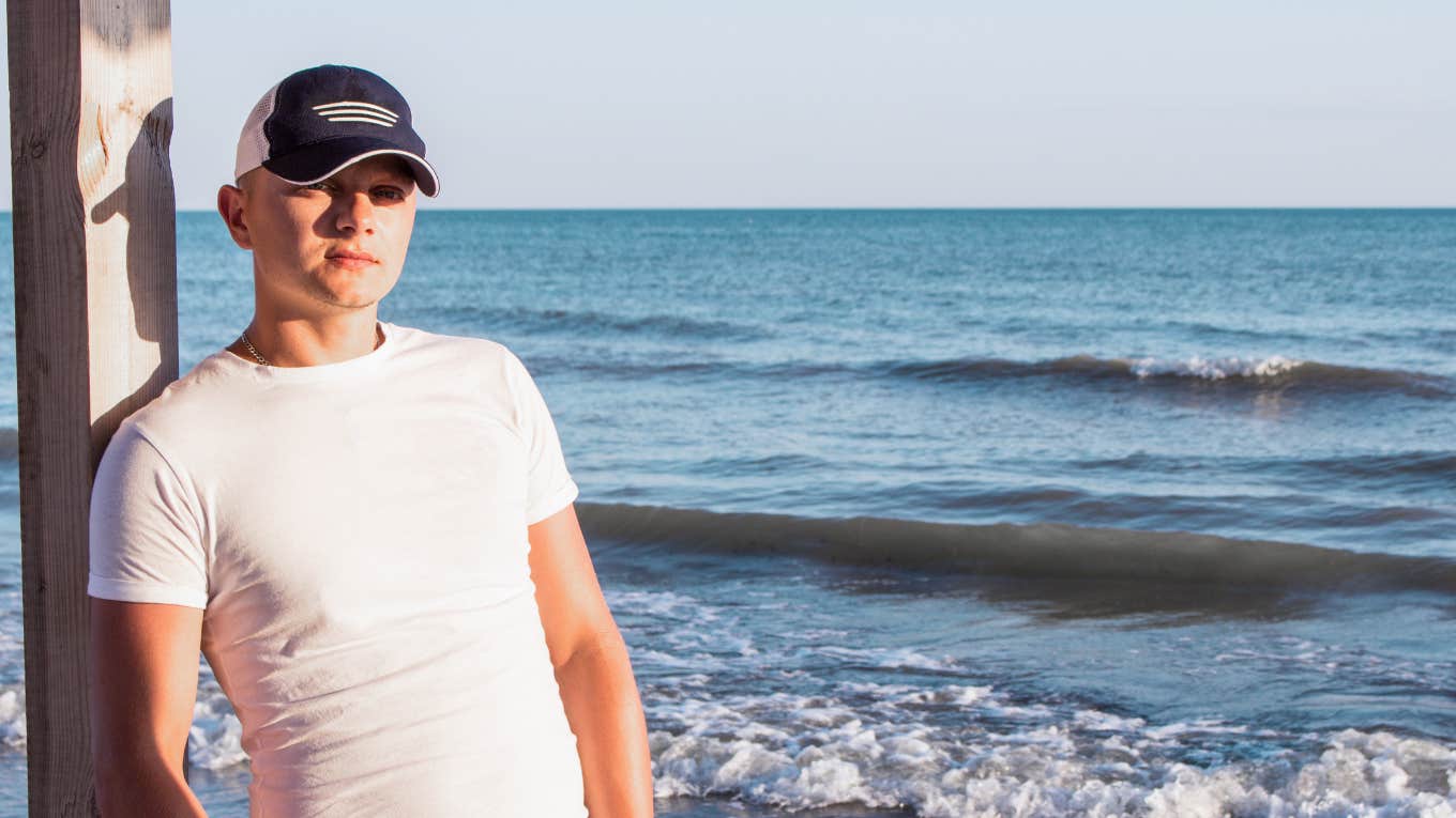 Man looking serious at the beach 