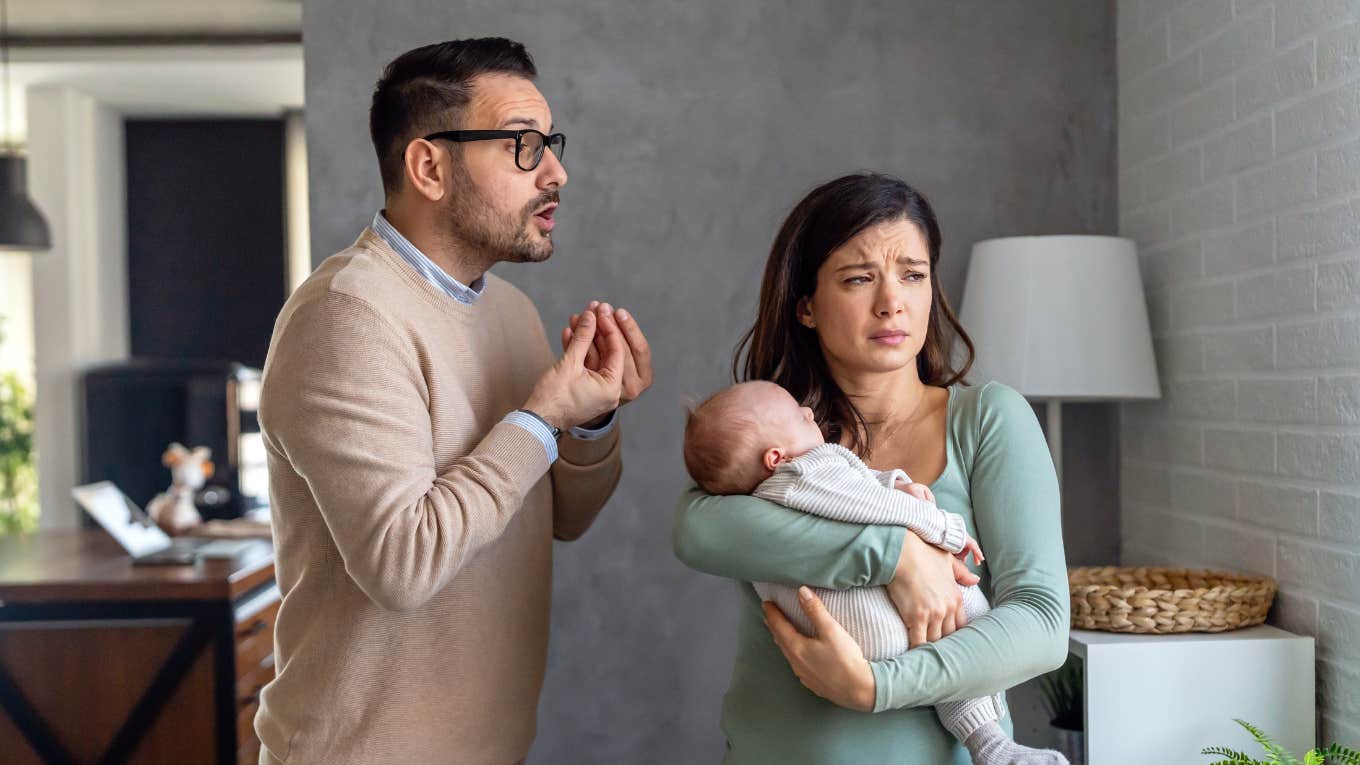 Husband and wife having an argument about nursing the baby in public