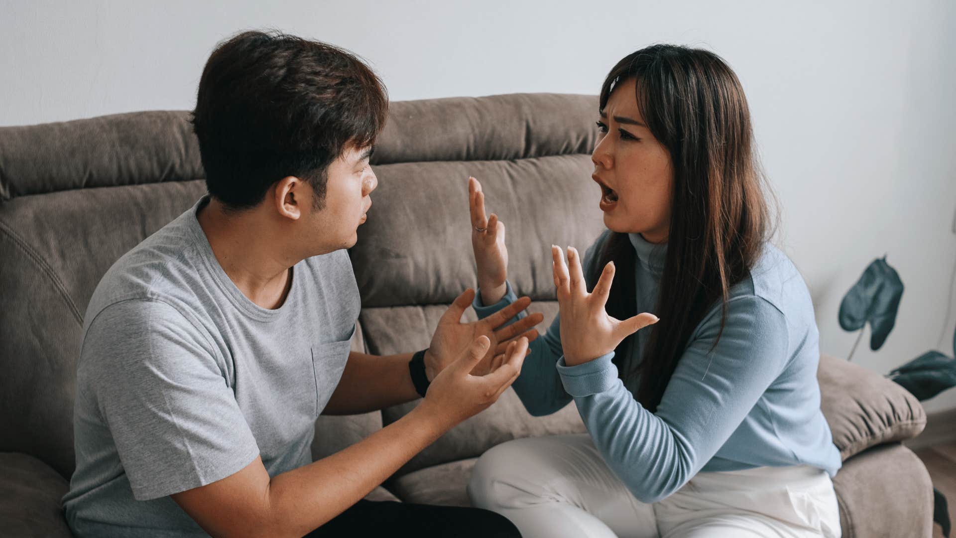 Arguing couple gestures with hands 