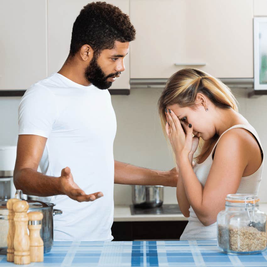 interracial couple arguing in kitchen