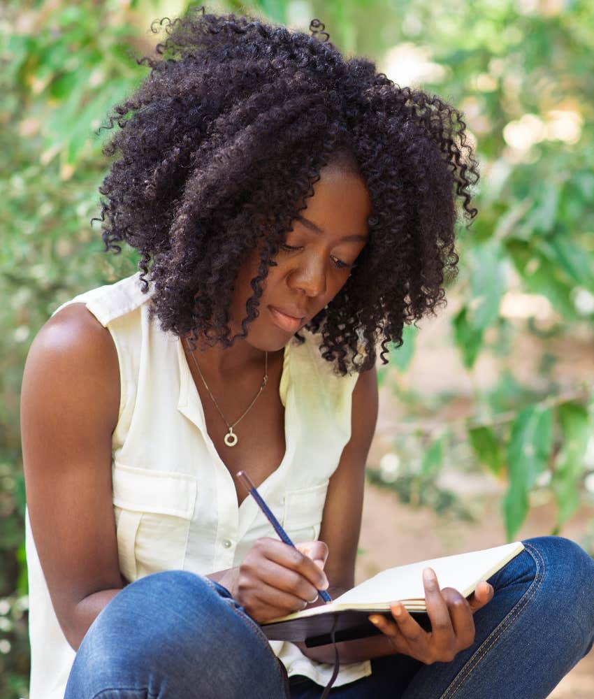 woman journaling in the park