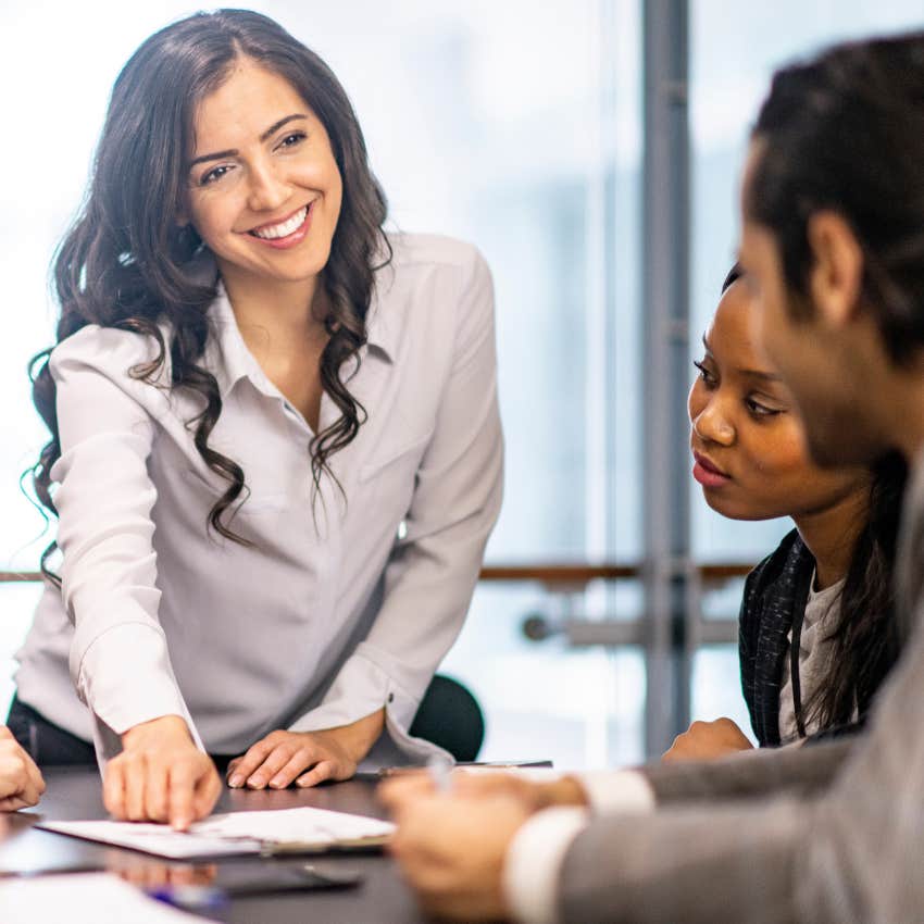 Drama-free leader talking with peers in a meeting. 