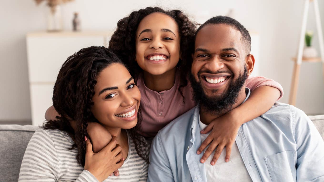 happy family smiling on the couch