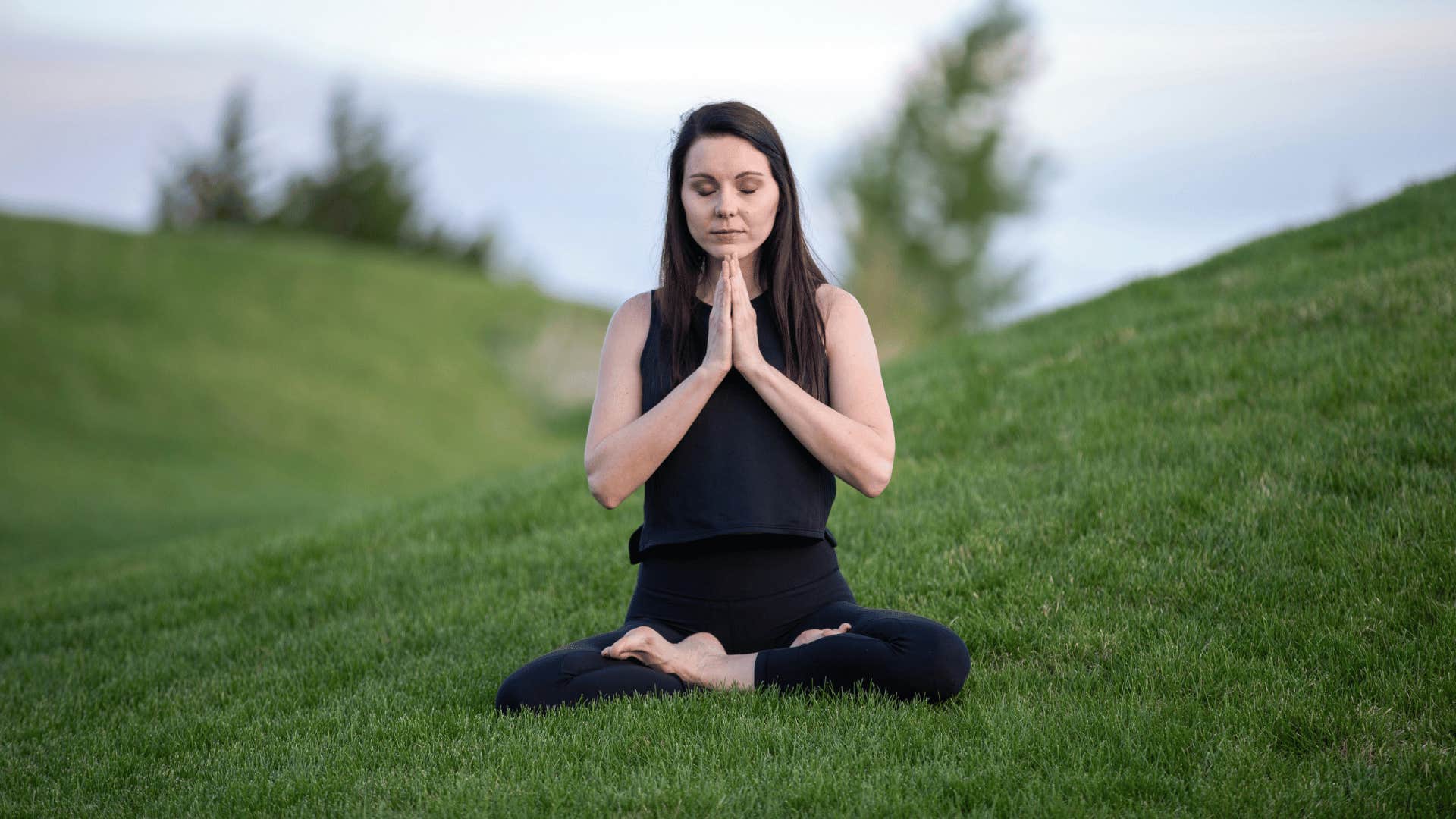 woman meditating in nature