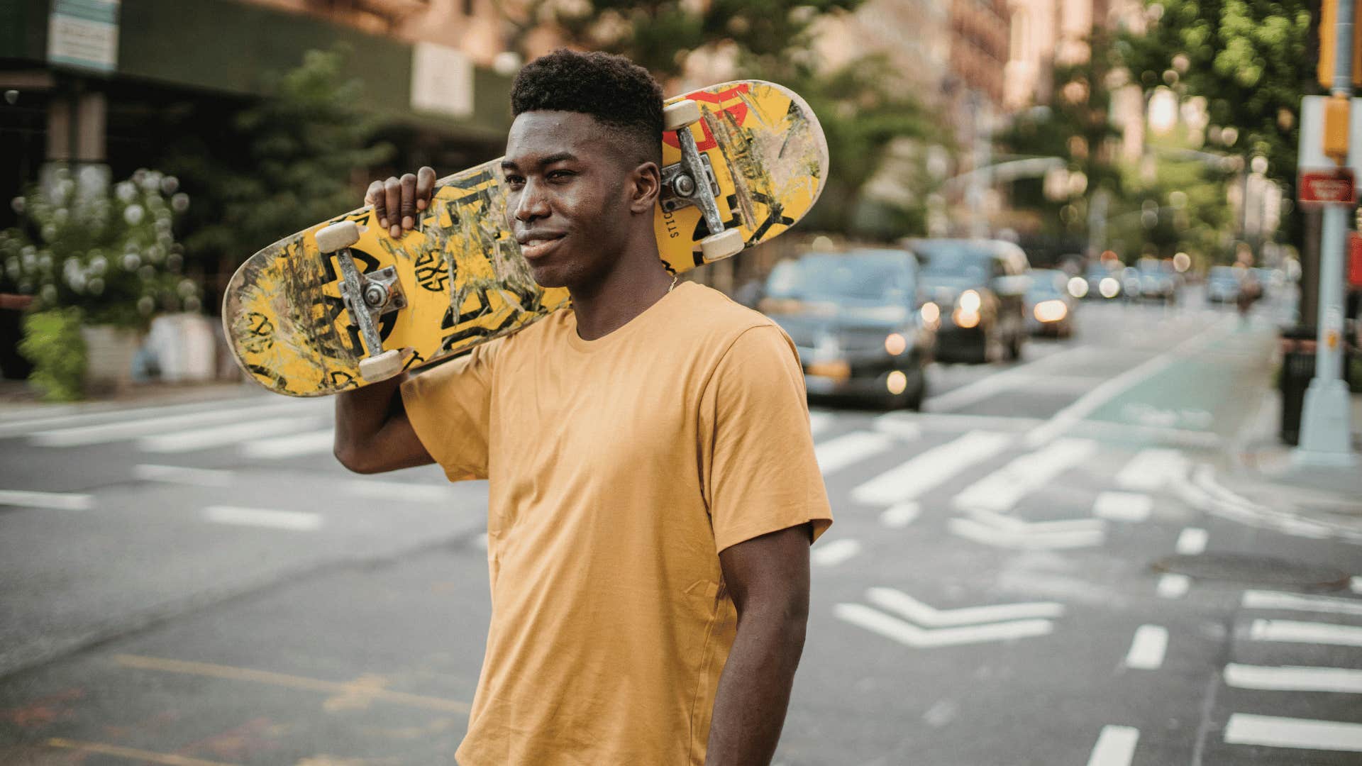 man holding a skateboard